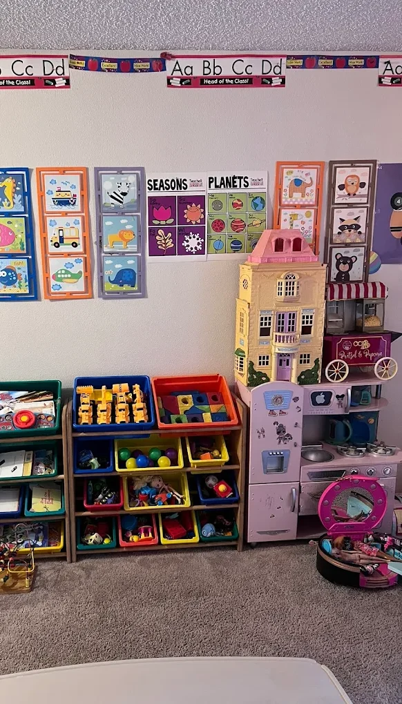 Learning corner with alphabet posters, educational displays and organized toy shelves